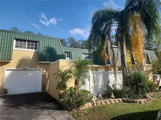 view of front of property featuring a garage