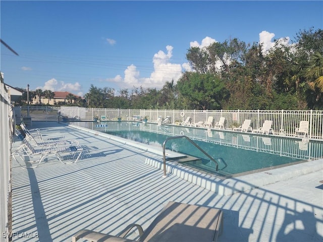 view of swimming pool featuring a patio