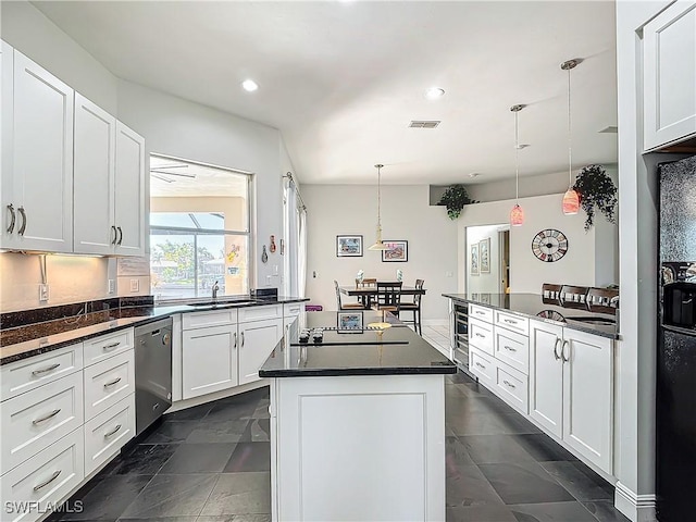 kitchen featuring pendant lighting, dishwasher, white cabinets, and beverage cooler