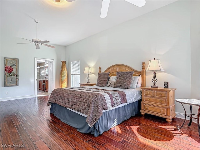 bedroom with connected bathroom, ceiling fan, and dark wood-type flooring