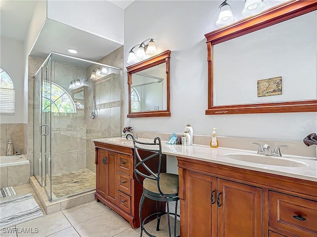 bathroom featuring tile patterned floors, vanity, and independent shower and bath