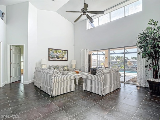 living room with ceiling fan and high vaulted ceiling