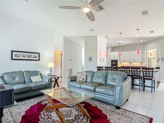 tiled living room featuring ceiling fan