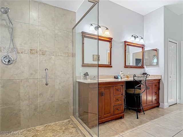 bathroom with vanity, tile patterned floors, and a shower with shower door