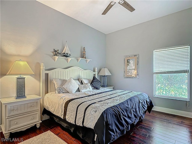 bedroom featuring ceiling fan and dark wood-type flooring