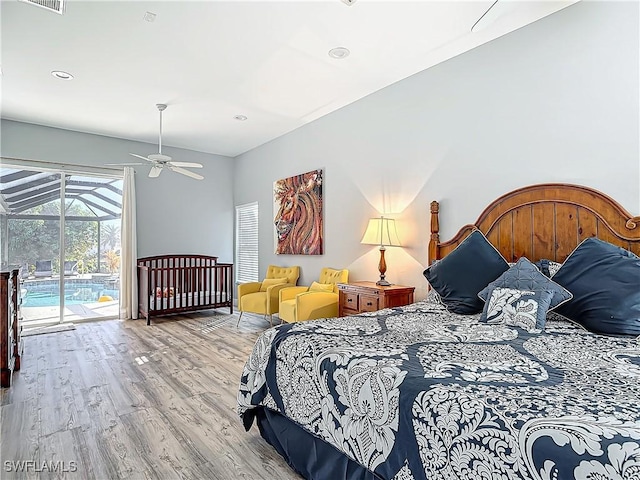 bedroom featuring access to exterior, ceiling fan, and wood-type flooring