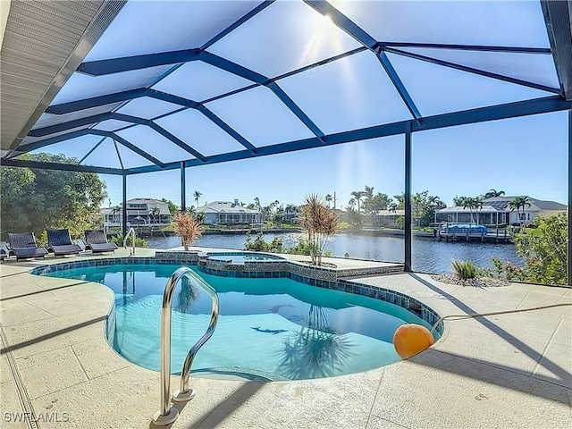 view of pool featuring a lanai, a water view, a patio, and an in ground hot tub