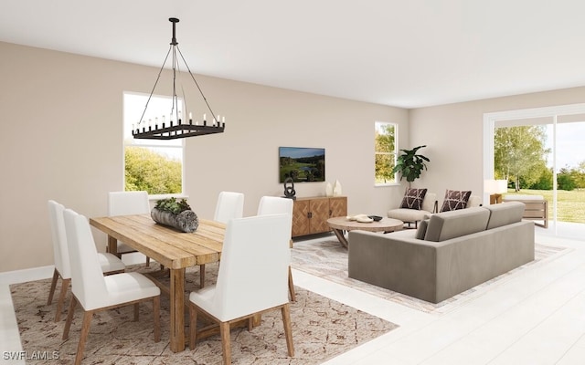 dining space featuring a notable chandelier