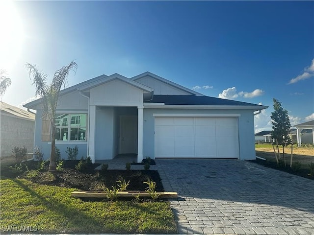 ranch-style house featuring a garage