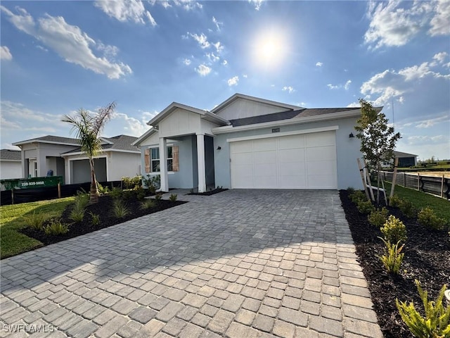 16349 Preservation Blvd, Punta Gorda, FL 33982 - ranch-style home featuring decorative driveway, stucco siding, and an attached garage