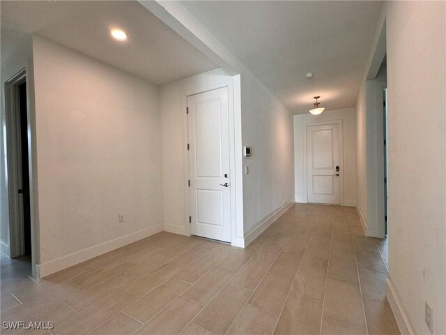 16349 Preservation Blvd, Punta Gorda, FL 33982 - hallway featuring baseboards and light wood finished floors