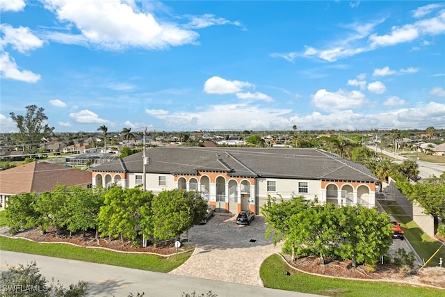 view of front of property featuring a residential view and driveway