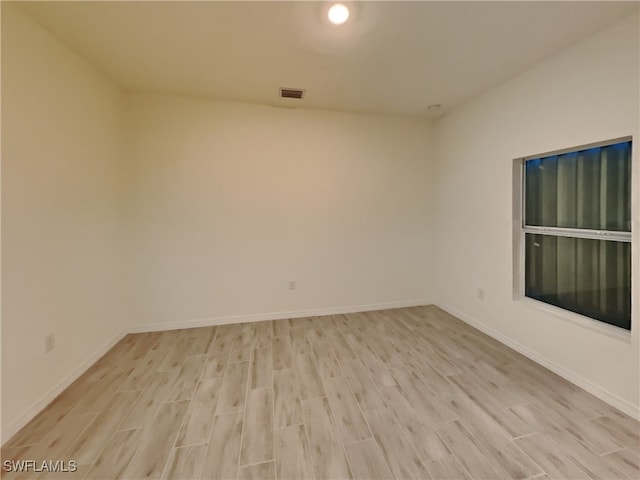 empty room with light wood-type flooring