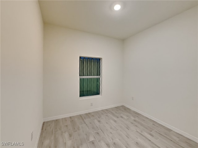 unfurnished room featuring light hardwood / wood-style flooring