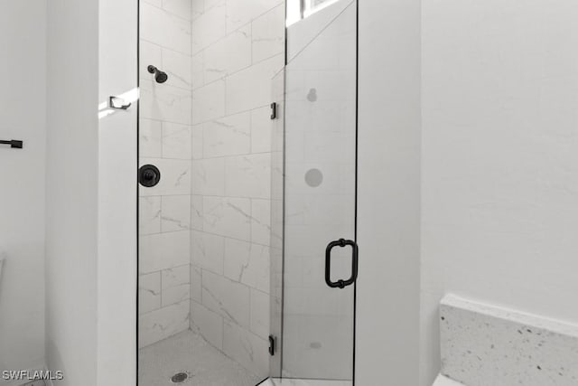 full bathroom with a shower stall