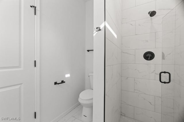 full bath featuring marble finish floor, baseboards, a shower stall, and toilet