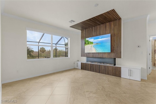 unfurnished living room featuring crown molding