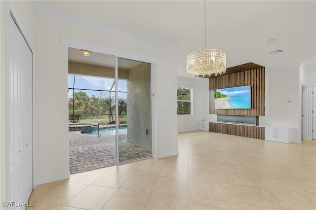 interior space with a notable chandelier and light tile patterned floors