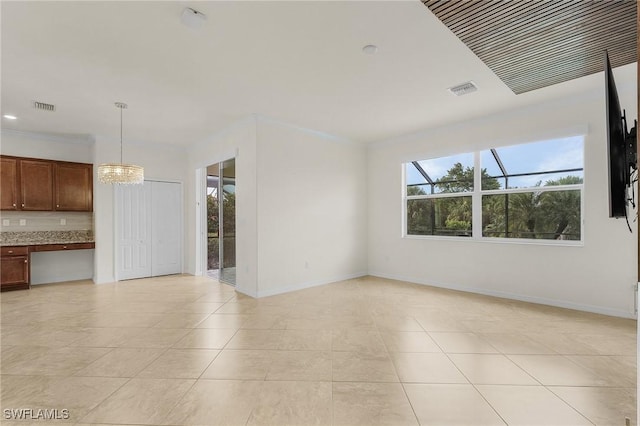 unfurnished living room featuring a notable chandelier, light tile patterned floors, and crown molding