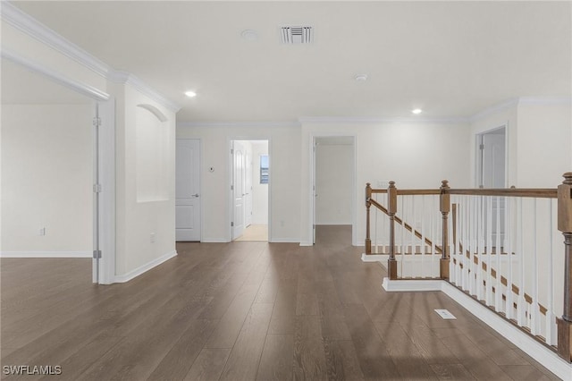 interior space with dark hardwood / wood-style floors and crown molding