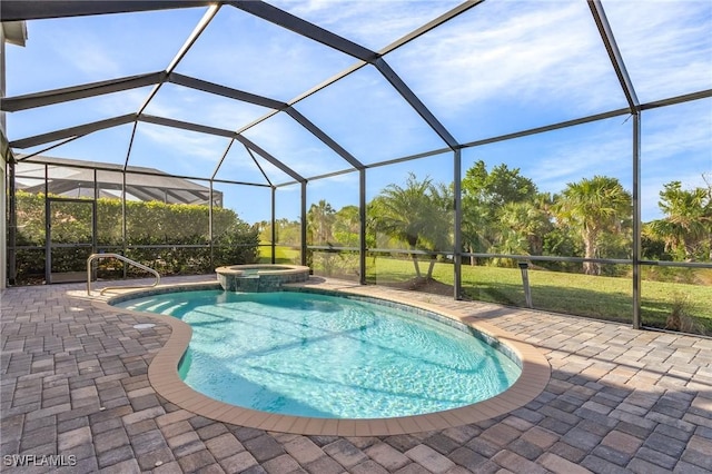 view of pool featuring a lanai, an in ground hot tub, and a patio