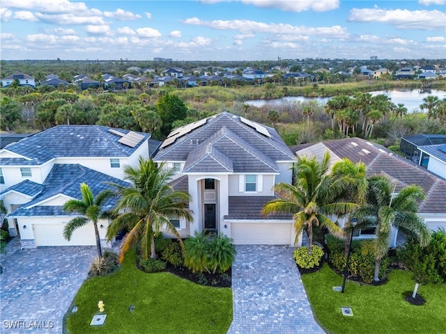 birds eye view of property with a water view