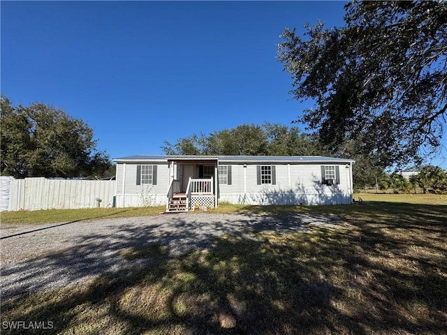 manufactured / mobile home with a front lawn