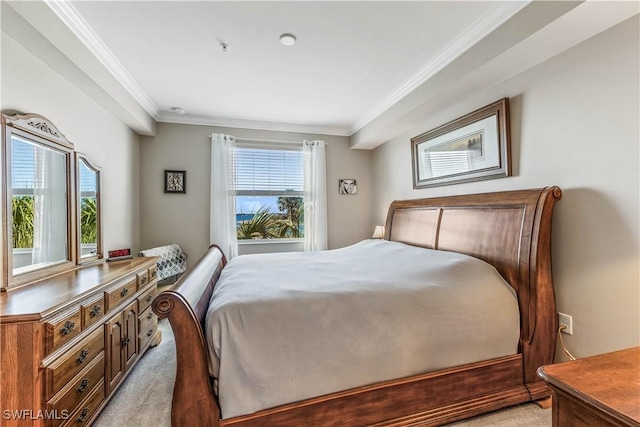 bedroom featuring multiple windows, crown molding, and light colored carpet