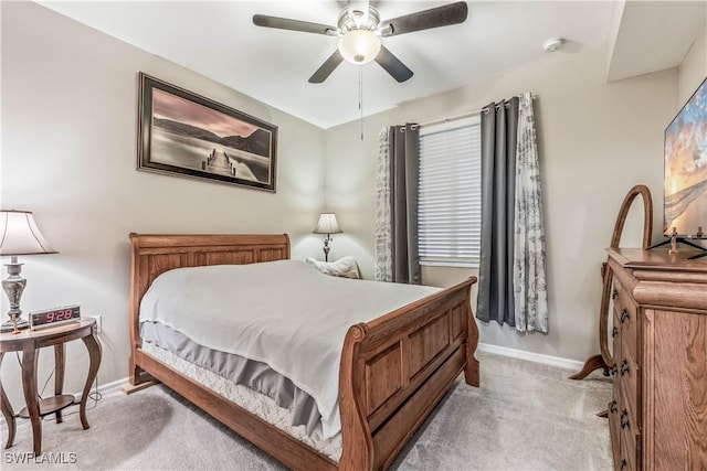 bedroom featuring ceiling fan and light carpet