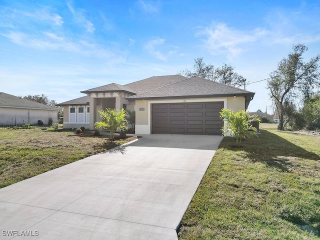 view of front of home with a garage and a front lawn