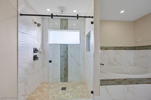 bathroom featuring shower with separate bathtub and a wealth of natural light