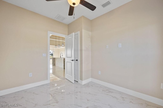 spare room with ceiling fan