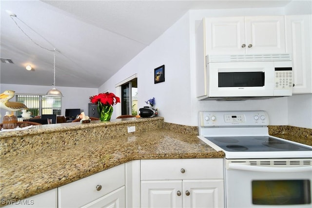 kitchen featuring white appliances, decorative light fixtures, white cabinetry, and lofted ceiling