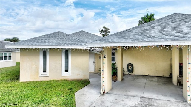 back of house featuring a patio area and a yard