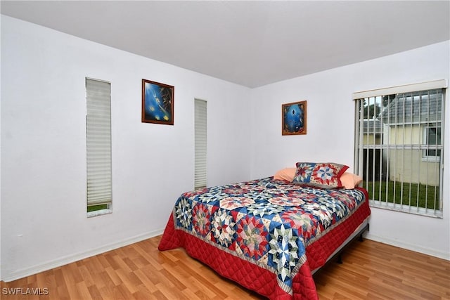 bedroom featuring wood-type flooring