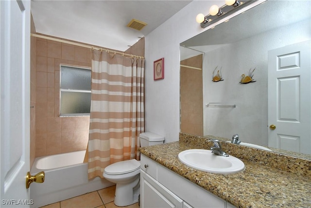 full bathroom featuring toilet, shower / bath combo, vanity, and tile patterned floors