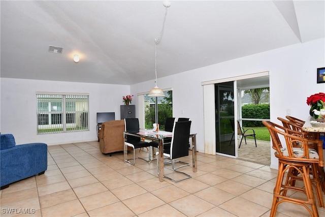 dining room featuring light tile patterned floors and plenty of natural light