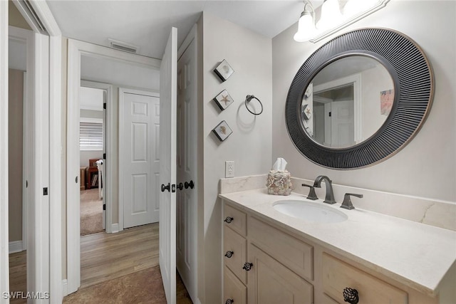 bathroom featuring vanity and wood-type flooring