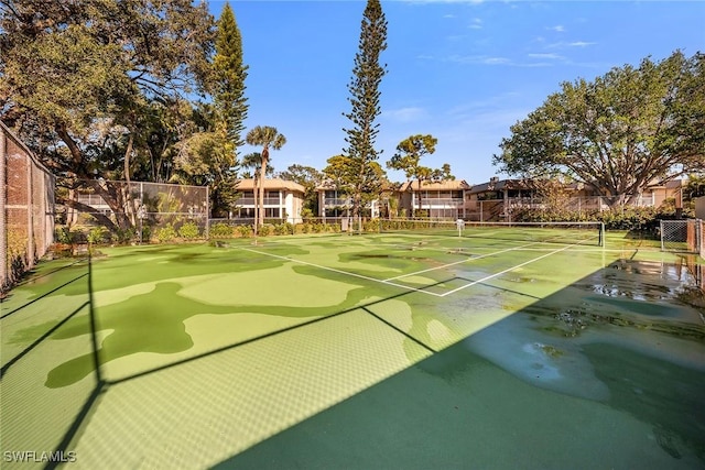 surrounding community with tennis court