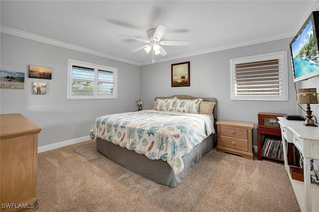 carpeted bedroom with ceiling fan and ornamental molding