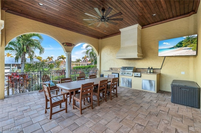 view of patio / terrace with ceiling fan, grilling area, and an outdoor kitchen