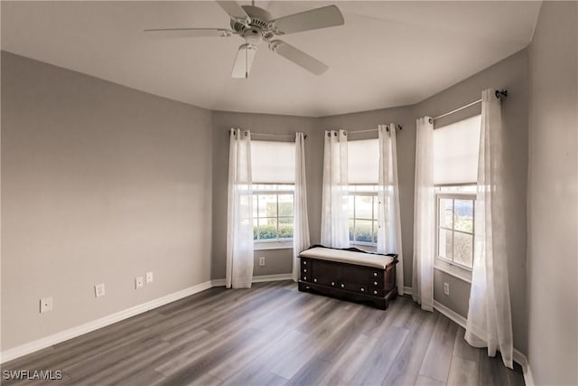 unfurnished room with hardwood / wood-style flooring and ceiling fan