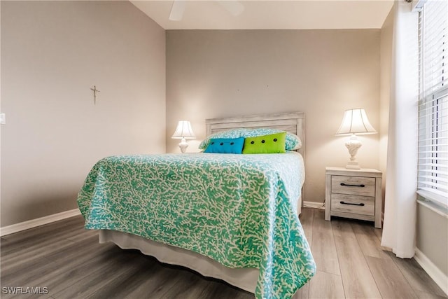 bedroom featuring ceiling fan and wood-type flooring