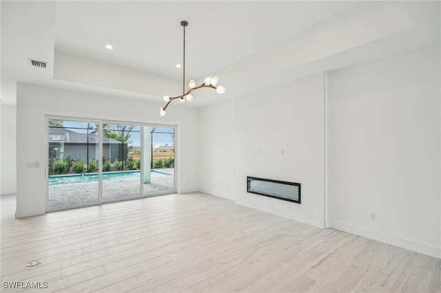 unfurnished living room with light wood-type flooring