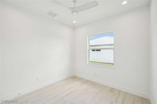 spare room with light wood-type flooring