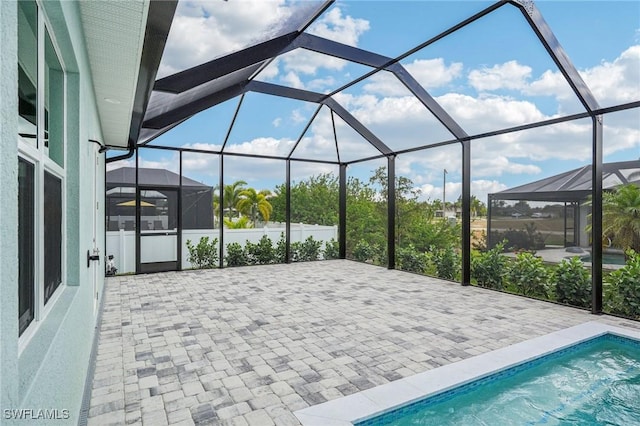 view of patio / terrace with a lanai