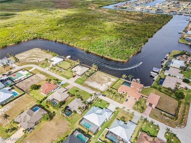 bird's eye view with a water view