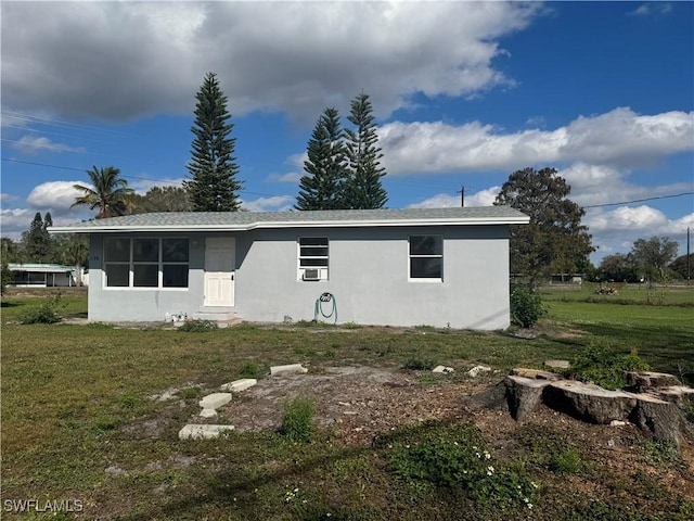 view of home's exterior featuring a lawn