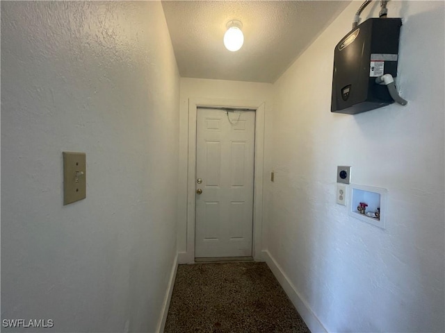 clothes washing area with electric dryer hookup, carpet flooring, washer hookup, and a textured ceiling