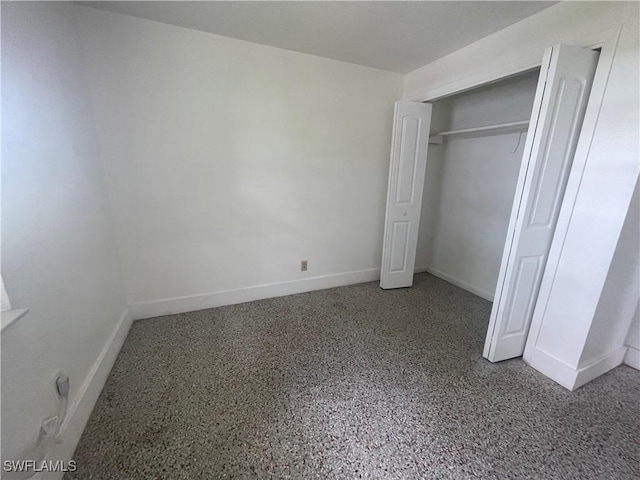 unfurnished bedroom with a closet